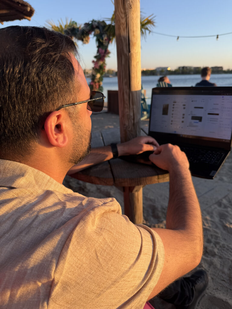 Milad Rahmani UX designer and product owner working remotely on laptop